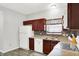 The kitchen is with white appliances, stylish counters, and wood-look flooring at 5841 Sable Dr, Indianapolis, IN 46221