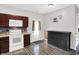 The kitchen has white appliances, stylish counters, and wood-look flooring, with adjacent cabinet at 5841 Sable Dr, Indianapolis, IN 46221