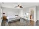 The main bedroom features wood-look floors, a ceiling fan, and neutral decor at 5841 Sable Dr, Indianapolis, IN 46221