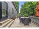 Outdoor back deck featuring a dining table and seating, ideal for entertaining or relaxing in the backyard at 5903 Birchwood Ave, Indianapolis, IN 46220