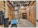 Unfinished basement with exposed pipes and insulation, offering potential for customization and ample storage at 5903 Birchwood Ave, Indianapolis, IN 46220