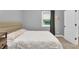 Bedroom with soft light, neutral walls, and ample natural light at 5903 Birchwood Ave, Indianapolis, IN 46220