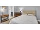 Comfortable bedroom featuring neutral walls, carpet floors, and an ensuite bathroom at 5903 Birchwood Ave, Indianapolis, IN 46220