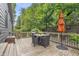 Outdoor deck area perfect for entertaining with a table, chairs, and patio umbrella at 5903 Birchwood Ave, Indianapolis, IN 46220