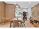 Bright and open dining room features hardwood floors, modern lighting, and weaving station at 5903 Birchwood Ave, Indianapolis, IN 46220
