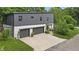 Modern home exterior with gray siding, a two-car garage, and a welcoming front entrance at 5903 Birchwood Ave, Indianapolis, IN 46220