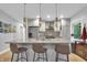 Bright modern kitchen featuring quartz counters, stainless steel appliances, and a stylish island at 5903 Birchwood Ave, Indianapolis, IN 46220