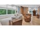 Comfortable living area with hardwood floors, modern furniture, and natural light from large window at 5903 Birchwood Ave, Indianapolis, IN 46220