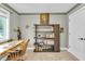 Home office featuring a wooden desk, comfortable chair, bookshelf, and natural lighting at 5903 Birchwood Ave, Indianapolis, IN 46220