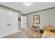 Cozy home office with a view into hallway, featuring desk, printer and closet at 5903 Birchwood Ave, Indianapolis, IN 46220
