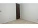 Neutral bedroom features carpeted floors, painted walls, and a convenient closet at 6408 W Taylor Rd, Muncie, IN 47304