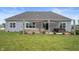 Beautiful backyard featuring a patio, hot tub, and outdoor seating area at 6420 Colt Ln, Anderson, IN 46013