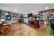 Finished basement featuring a bar area, multiple TVs, and sports-themed decor at 6420 Colt Ln, Anderson, IN 46013
