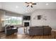 Comfortable living room with vaulted ceilings, a cozy fireplace, and neutral decor at 6420 Colt Ln, Anderson, IN 46013