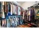 Walk-in closet with ample storage, multiple shelves, and hanging rods for organized clothing and accessories at 6420 Colt Ln, Anderson, IN 46013