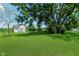 Spacious backyard featuring lush green grass and a storage shed at 6550 Reed Rd, Pittsboro, IN 46167