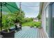 Inviting backyard deck with patio furniture, an umbrella, potted plants, and privacy at 6550 Reed Rd, Pittsboro, IN 46167