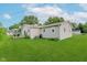 View of home's backyard and its well-maintained lawn, siding and patio at 6550 Reed Rd, Pittsboro, IN 46167