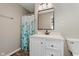 Bathroom features a new vanity with drawers, quartz countertop, a modern faucet, a shower, and light fixtures at 6550 Reed Rd, Pittsboro, IN 46167