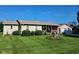 Well-kept home with a neat front yard, tidy landscaping, and a welcoming front porch adorned with American flags at 6550 Reed Rd, Pittsboro, IN 46167