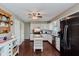 Bright kitchen with white cabinets, stainless steel appliances, and a functional center island at 6550 Reed Rd, Pittsboro, IN 46167
