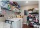 Organized laundry room with shelving, washer, and dryer units at 6550 Reed Rd, Pittsboro, IN 46167