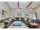 Comfortable living room with hardwood floors, neutral walls, and ample seating for entertaining at 6550 Reed Rd, Pittsboro, IN 46167