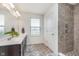Bathroom with updated tile shower, double sink vanity, and plenty of natural light at 6589 Kara Ln, Brownsburg, IN 46112