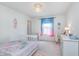 Bright bedroom with white walls, carpet floor, natural light, and white furniture at 6589 Kara Ln, Brownsburg, IN 46112
