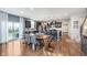 Open concept kitchen with an island, dark cabinets, granite countertops, stainless appliances, and hardwood floors at 6589 Kara Ln, Brownsburg, IN 46112