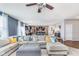 Inviting living room featuring comfortable seating, natural light, and an open layout to the kitchen and dining area at 6589 Kara Ln, Brownsburg, IN 46112
