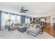 Spacious living room featuring plush carpet, a large sectional sofa, plenty of windows, and an open floor plan at 6589 Kara Ln, Brownsburg, IN 46112