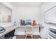 Bright home office area with a granite desk and natural light from the window at 6589 Kara Ln, Brownsburg, IN 46112