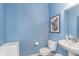 Stylish blue powder room with modern fixtures and elegant decor at 6589 Kara Ln, Brownsburg, IN 46112