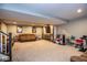 Spacious basement rec room with comfortable seating, a mounted television, and recessed lighting at 7128 Verwood Ct, Plainfield, IN 46168