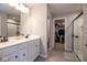 Bright bathroom features a double sink vanity, walk-in closet, and large walk-in shower at 7128 Verwood Ct, Plainfield, IN 46168