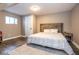 Warm bedroom with a rustic wooden headboard, hardwood floors, and natural light at 7128 Verwood Ct, Plainfield, IN 46168
