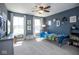 Cozy bedroom with playful decor, carpet flooring, and bright natural light from large windows at 7128 Verwood Ct, Plainfield, IN 46168
