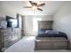 Comfortable bedroom features carpet, a dresser, a bed with storage and a window for natural light at 7128 Verwood Ct, Plainfield, IN 46168