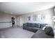 Upstairs living area with cozy seating and neutral walls, perfect for relaxing or entertaining at 7128 Verwood Ct, Plainfield, IN 46168
