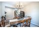 Cozy dining room area featuring a modern chandelier, and rustic decor to create a welcoming space at 7128 Verwood Ct, Plainfield, IN 46168