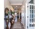 Inviting hallway showcasing stylish decor, hardwood floors, and a seamless transition to other living spaces at 7128 Verwood Ct, Plainfield, IN 46168