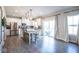 Spacious kitchen features a granite island with seating, stainless appliances and sliding doors at 7128 Verwood Ct, Plainfield, IN 46168