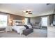 Large main bedroom is complete with a ceiling fan, plenty of windows, and neutral decor at 7128 Verwood Ct, Plainfield, IN 46168