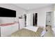 Bright primary bedroom featuring a walk-in closet, ensuite bath, and stylish contemporary furnishings at 757 Carson Ln, Greenfield, IN 46140
