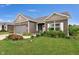 Charming single-Gathering home featuring brick and vinyl siding, a two-car garage, and a beautifully landscaped front yard at 757 Carson Ln, Greenfield, IN 46140