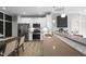 Modern kitchen with stainless steel appliances, white cabinets, wood countertops, and an island with bar seating at 757 Carson Ln, Greenfield, IN 46140