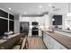 Modern kitchen with stainless steel appliances, white cabinets, and an eat-in dining area at 757 Carson Ln, Greenfield, IN 46140