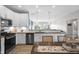 Modern kitchen with stainless steel appliances, white cabinets, wooden countertop, and an open layout at 757 Carson Ln, Greenfield, IN 46140