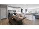 Bright kitchen with stainless steel appliances, white cabinetry, wood countertops, and an island seating area at 757 Carson Ln, Greenfield, IN 46140